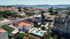 an aerial view of a city with a pool at Pool house LUKA in Zadar