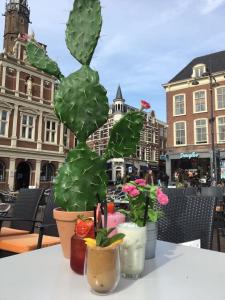 
a flower arrangement on a table in front of a building at Amadeus Hotel in Haarlem
