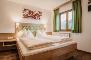 Ein Bett oder Betten in einem Zimmer der Unterkunft DAS "Bergzeit" - Appartements