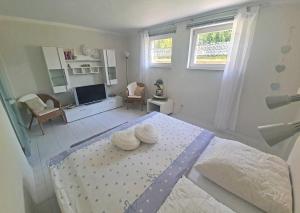 Una cama o camas en una habitación de Ferienwohnung Plau am See SEE 3662