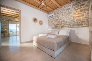 A bed or beds in a room at Irene Komos Independent House