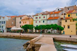 a group of buildings next to a body of water at DIANA MORE in Baška
