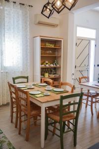 a dining room with a table and chairs at S'Ilixi in Quartucciu