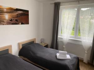 Postel nebo postele na pokoji v ubytování Apartmány Krupka
