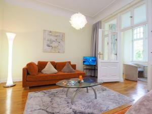 TV a/nebo společenská místnost v ubytování Villa Annelies Wohnung 1
