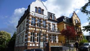 a large building with a clock on top of it at Villa Magdalena 05 in Ahlbeck