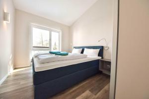 Llit o llits en una habitació de Haus Seven Seas - Wohnung Atlantik
