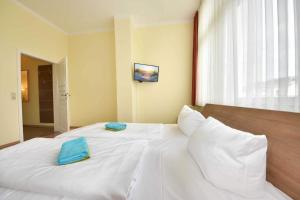 Ein Bett oder Betten in einem Zimmer der Unterkunft (27a) Villa Seestern 05