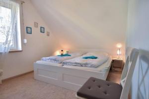 Postel nebo postele na pokoji v ubytování Ferienhaus Waldhaus + 9 fotografií