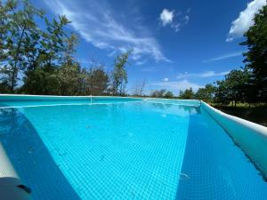 an empty swimming pool with a blue sky in the background at Jugendtours-Feriendorf Ummanz in Ummanz