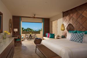 a bedroom with a bed and a living room at Secrets Maroma Beach Riviera Cancun - Adults only in Playa del Carmen +62 photos