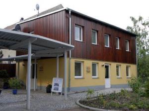 a large building with a sign in front of it at Stiftung soziale Projekte Meißen in Meißen