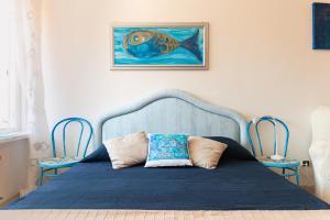 Un pat sau paturi într-o cameră la Sea & Culture