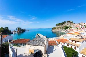 a view of a town and the ocean at Petros Penthouse in Parga