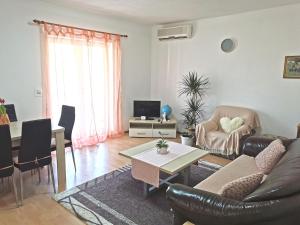 a living room with a couch and a table at Apartments Biočić in Korčula