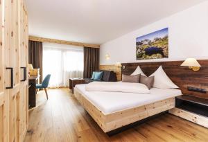 Rúm í herbergi á Hotel Garni Tirol