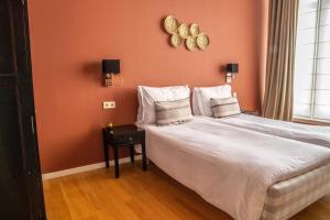 Rúm í herbergi á Hotel ML
