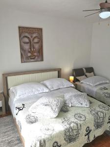 Кровать или кровати в номере Apartments Biočić
