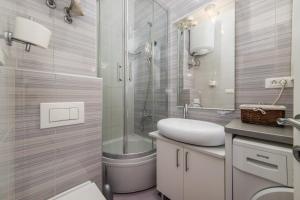 Koupelna v ubytování Apartment Riva + 37 fotografií
