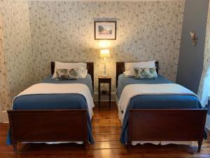 Ένα ή περισσότερα κρεβάτια σε δωμάτιο στο The Lily Inn - Burlington