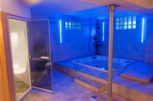 Letto o letti in una camera di Active & Wellness Hotel Subterra