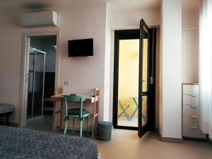 TV a/nebo společenská místnost v ubytování Lo Spicchio b&b