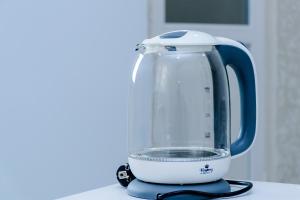 a blue and white blender sitting on a counter at Эдем 3 in Chornomorsk