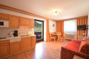 Kuchyň nebo kuchyňský kout v ubytování Sonnenhof Walchsee + 18 fotografií