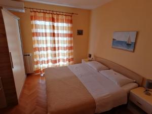 Posteľ alebo postele v izbe v ubytovaní Apartments Tonka Franković