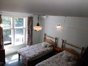 Postel nebo postele na pokoji v ubytování Greystones B&B