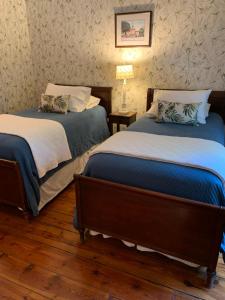 Ένα ή περισσότερα κρεβάτια σε δωμάτιο στο The Lily Inn - Burlington