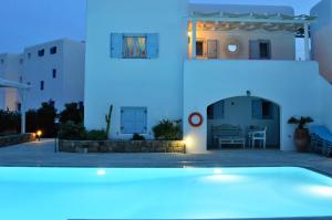 a view of a house at night with blue lights at Blue Heart Mykonos Up to 10 People Best Location in Mikonos