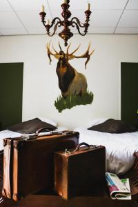 Postel nebo postele na pokoji v ubytování Hotel Eethuys de Wormshoef + 24 fotografií