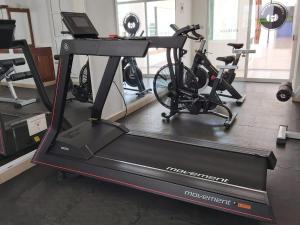 a treadmill in a gym with two bikes on it at Hotel Rockaway in Puerto Escondido +101 photos