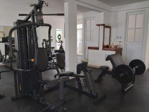 a gym with several treadmills and tread machines at Hotel Rockaway in Puerto Escondido