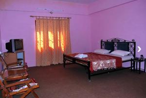 Cama ou camas em um quarto em Nature Inn Homestay