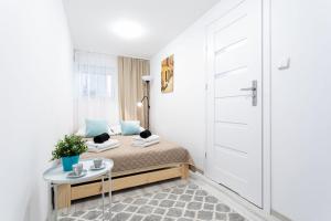 Posteľ alebo postele v izbe v ubytovaní Apartament Palermo