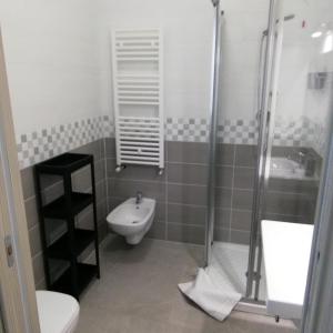 a bathroom with a shower and a toilet and a sink at A casa di cinzia in Pineto +42 photos