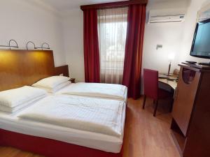 Ein Bett oder Betten in einem Zimmer der Unterkunft Hotel Via Roma