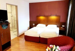 Ein Bett oder Betten in einem Zimmer der Unterkunft Hotel Via Roma