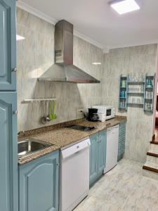 A kitchen or kitchenette at Apartamentos La Posada de Abanillas