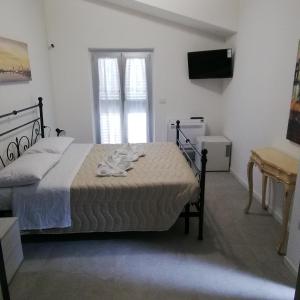 Ένα ή περισσότερα κρεβάτια σε δωμάτιο στο A casa di cinzia