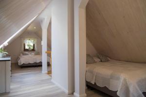 Posteľ alebo postele v izbe v ubytovaní Apartamenty EDEN jacuzzi, sauna
