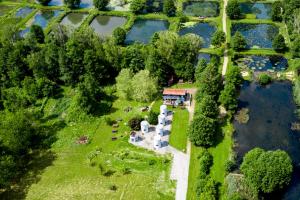 an aerial view of a house next to a lake at slube 25 Teiche Rottstock in Rottstock