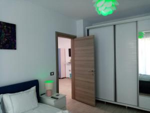 a living room with a bed and a closet at Sunrise in Mamaia Nord +48 photos