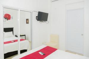 Postel nebo postele na pokoji v ubytování Hostal San Francisco de Asis