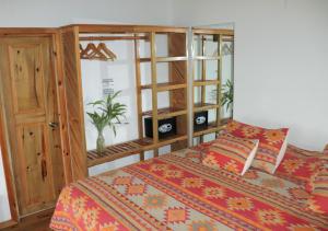 Letto o letti in una camera di Hotel Posada Seremein ,West Bay ,Roatan