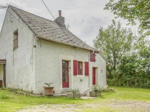 an old white house with red shutters at Country house near Canal du Nivernais in Devay