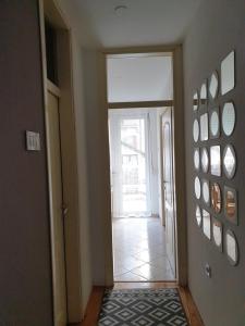 a hallway with a door leading into a room at Stan na dan "Irina" Banja Luka in Banja Luka