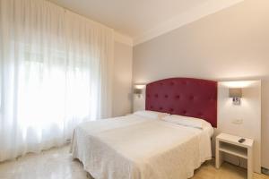Postel nebo postele na pokoji v ubytování Albergo Battelli Only Adults